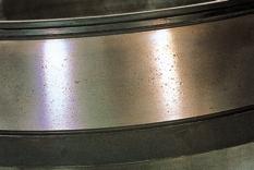 objects. Photo G-3 Rollers of tapered roller bearings Dents all over rolling contact surfaces. (Temper color at two ends.