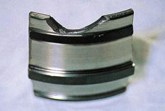 Photo H-3 Inner ring of tapered roller bearing Chipping of cone back face rib The cause is