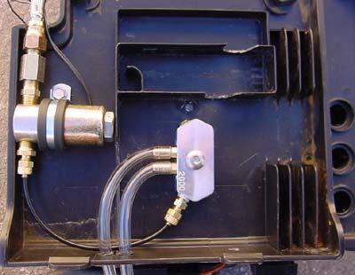 An alternate location is to install the nitrous manifold on the front of the airbox (the coil must be relocated) or on the right side of the airbox (shown below). 2.