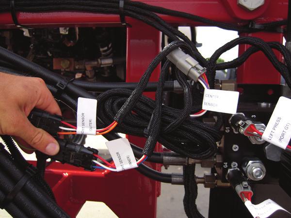 Locate the Left Sensor (Outer) connector on the AutoBoom harness cable. 2. Connect the Left Sensor (Outer) connector to the sensor cable (P/N 115-0171-527) installed on the end of the left boom. 3.