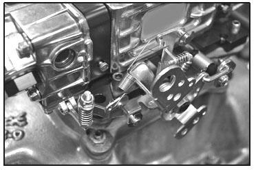 Install the throttle kickdown lever to the existing throttle lever using appropriate bolts, lockwashers, and nuts. Make sure the lever is secured properly. 2.