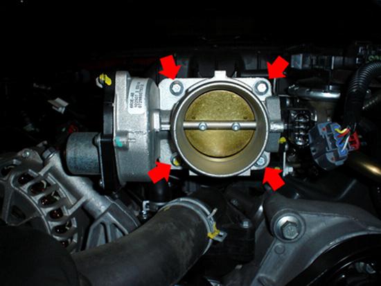 6. Using a 5/16 socket wrench, loosen the 4 bolts holding the