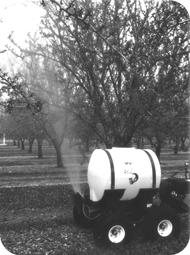 THE NARROW TREAD ALLOWS FOR SPRAYING IN ROW CENTERS AS CLOSE AS 6 FEET AND THE LIL SQUIRT ACCURATELY APPLIES SPRAY MATERIAL TO TREES UP TO 15 FEET TALL.