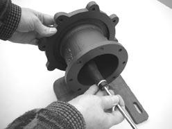 Remove the barrier (item 7) from the motor adapter (item 8). Make sure the spindle has been removed.