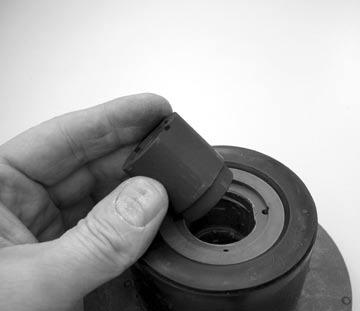 To remove the bushing, place the impeller/inner drive assembly in an arbor press.