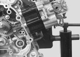 REFITTING SPECIFIC COMPONENTS - Install the cylinder head. - Install the chain guiding slipper on the crankcase pin (A) and the housing (B) in the crankcase on the exhaust port side.