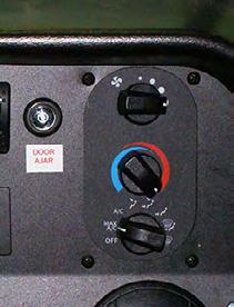 Heating Ventilation Air Conditioning (HVAC) Controls The heating system is controlled by three knobs located on the dash panel. The top knob on the heater control face controls the fan speed.