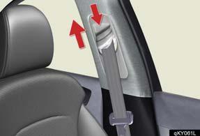 To lower: push the head restraint down while pressing the lock release button. To raise: pull the anchor upward.