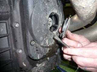 Pic 9: Pry out the rubber bung from the front of the alternator belt cover.