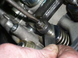 Pic 15: If necessary use a screwdriver in the slot of the adjuster to hold it while using the spanner to nip up the nut.