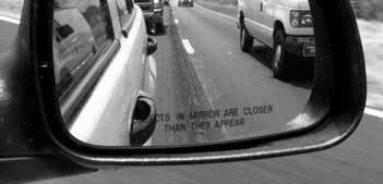 Seeing Around Your Vehicle Use Your Mirrors Blind Spots Adjust the mirrors to reduce the