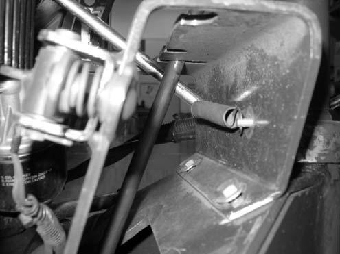 . Remove engine from machine: A. Connect a hoist or chain fall to lift tabs located on each of the cylinder heads. B.