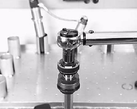 Apply a thin film of oil to the IFP o-ring and floating wear band located on the shock rod piston. 9. Compress the wear band and insert the IFP into the reservoir.