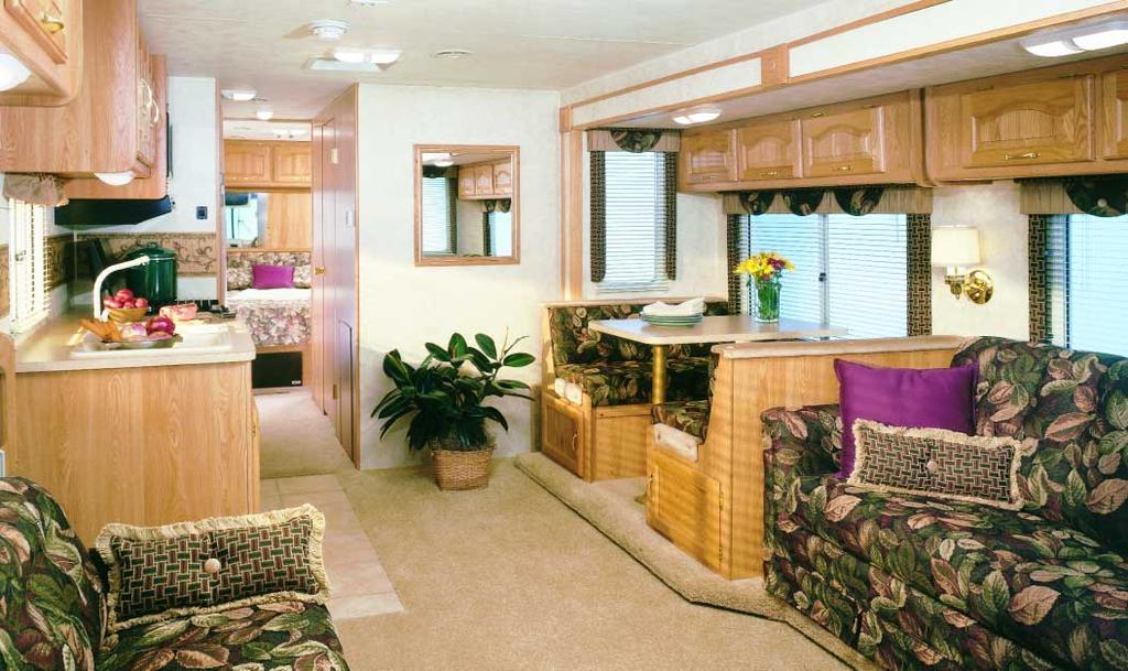 competitively priced RVs. Ceiling-ducted central air conditioning does a better job of cooling the coach and is up, out of the way of cabinets. Wall-mounted thermostatic control is optional.