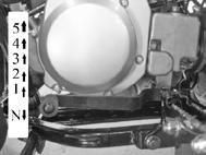 SHIFTING: This ATV has a 5 speed transmission with a centrifugal automatic clutch. To shift vehicle in neutral while driving, repeatedly depress the gear shift lever.