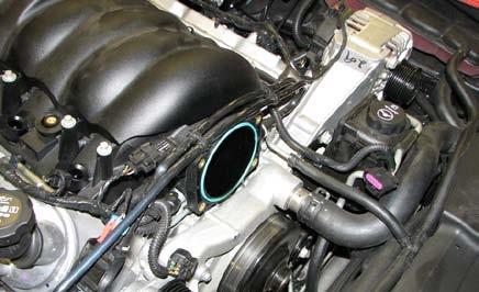 Remove the intake manifold and disconnect the small vacuum hose at the rear of the