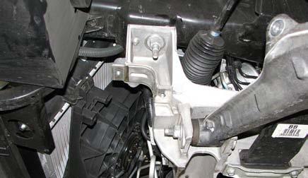 Use a 10mm socket to remove the bolts retaining the power steering