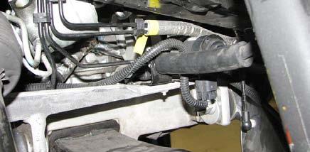 Use a floor jack to support the oil pan. 75.