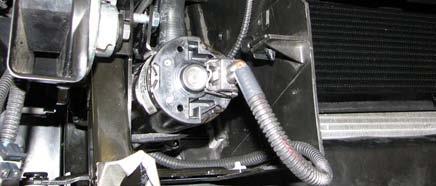 144. Route the intercooler water pump wire harness extending from the relay down to the intercooler water pump and