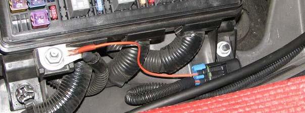 Install long end of molded hose on intercooler reservoir outlet so that the hose will extend out and then