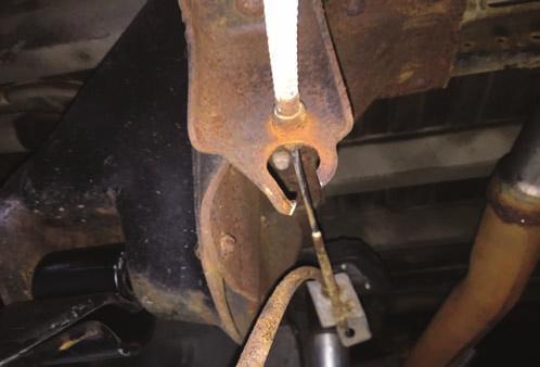 Apply paint to cut surfaces to prevent rust. Photo 7 Photo 8 Cut E-brake bracket.