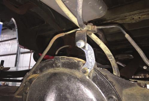 14. Attach rear brake line relocation bracket to the differential.