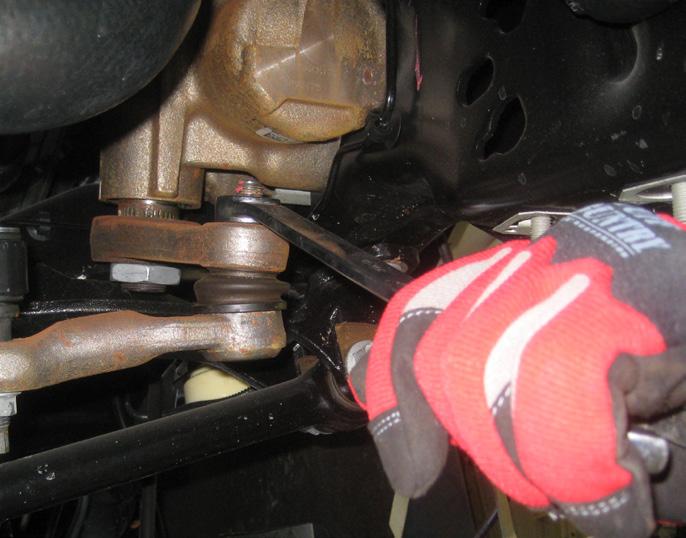Using a proper tie rod removal tool and/or a hammer, hit the end