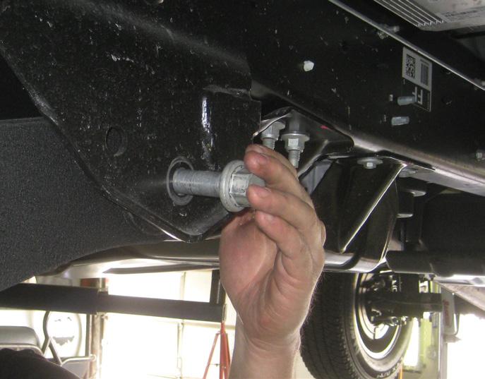 25. Locate (2) Brake line brackets. Also locate (2) 5/16 x 1 bolts, (4) 1/4 washers, and (2) 5/16 uni-torque nuts.