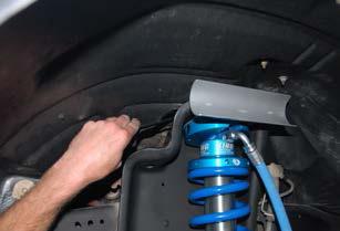 Place the coilover into the lower mount and secure using the supplied hardware.