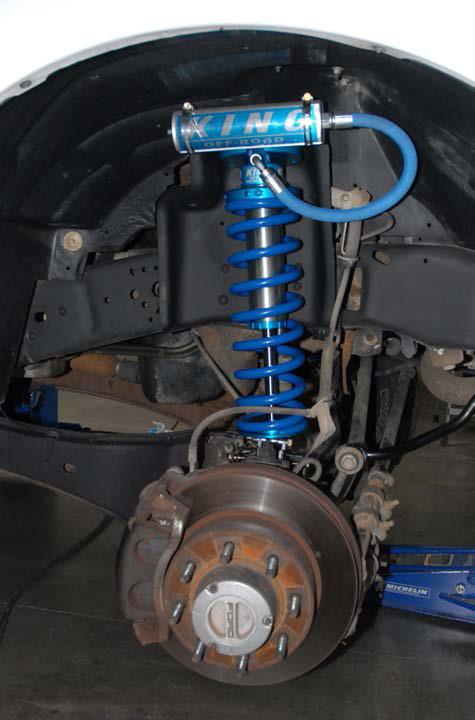 Failure to have the bolts in the correct orientation can cause damage to the hose fitting on the coilover.