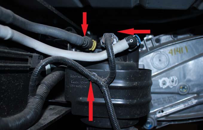 STEP 3 Wiggle and pull up on fuel line connector locks to allow the fuel supply and return lines to be