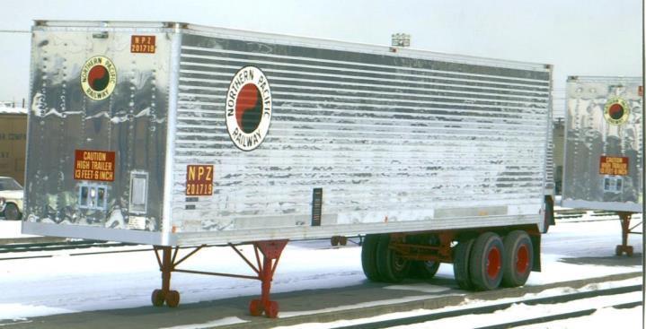 Image from Richard Yaremko Collection 4ft foot late era NPR herald, decal on trailer Road number on upper drivers-side of rear door Red road initials and numbers; sides, front 2ft NPR heralds on