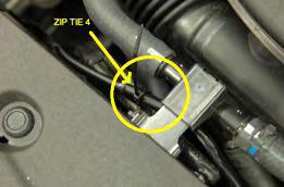 Route left side of wire harness down to left fog light and plug connector