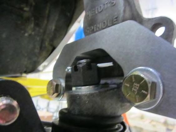 Figure 22 Figure 23 12) Install the spindles over the lower ball joints