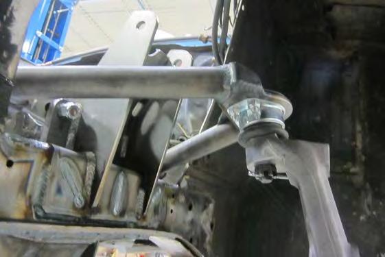 Driver Side, Spindle attached to Ball Joints, Figure 25 Upper Ball Joint Castle Nut installed, Figure 26 13) Install the coil over shocks.