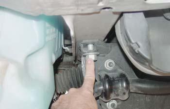 Using one of the supplied ½" x 4" bolts and nylock nuts, bolt through the second hole back in the driver side