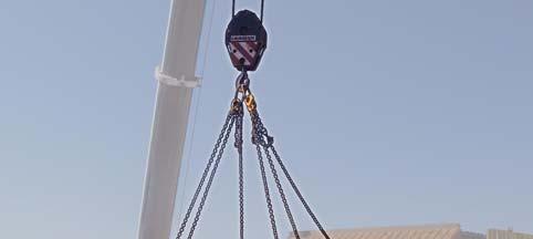 27. Basket a 5t x 5m sling around the belt on the South side of the head frame. Use the crane to lift the slack in the belt.