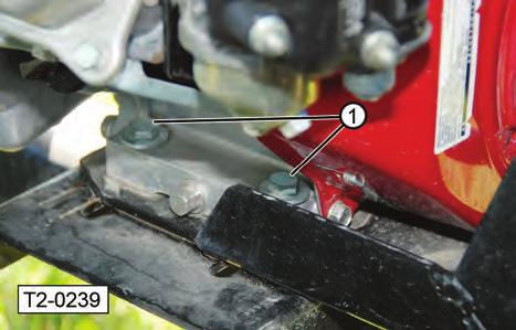 Loosen the jam nut on engine base adjusting bolt (2) and move the engine