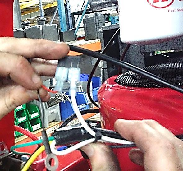 Cut cable ties holding White Wire to Ignition Harness.