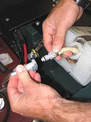 Pull out the hose connector from the FaST- PAK carton and remove cap (Figure 16).