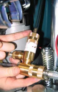 Disconnect the opposite end of the FaST supply hose from the injector assembly and drain the