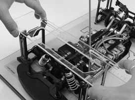 INITIAL STEPS Prepare the car as follows: Shocks: Attach the front and rear shocks. Wheels: Remove the wheels. Motor: Remove the pinion gear.