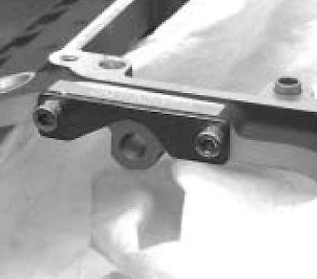 4. Fasten drill plate, JIMS No.8357 to the top of the trap door flange using old and new speed sensor mounting screws as shown in Figure 1. 5.