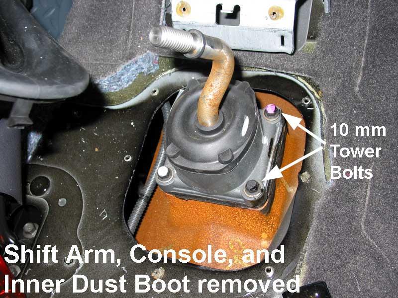 HINT: Mark the shift arm carrier and the transmission case to ensure correct alignment when