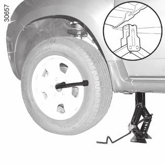 CHANGING A WHEEL (1/2) Switch on the hazard warning lights. Park the vehicle away from traffic on flat ground with a good level of grip. Engage the handbrake and put into gear (first or reverse).