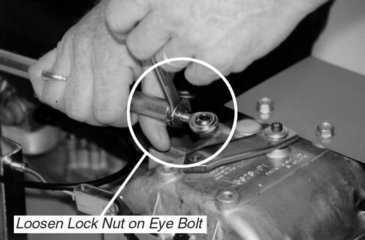 Move the shift lever into the reverse position. 3. Loosen and remove the tie rod nut and bolt from the transmission arm (Figure 33). Unhook the tie rod from the transmission arm. 4.