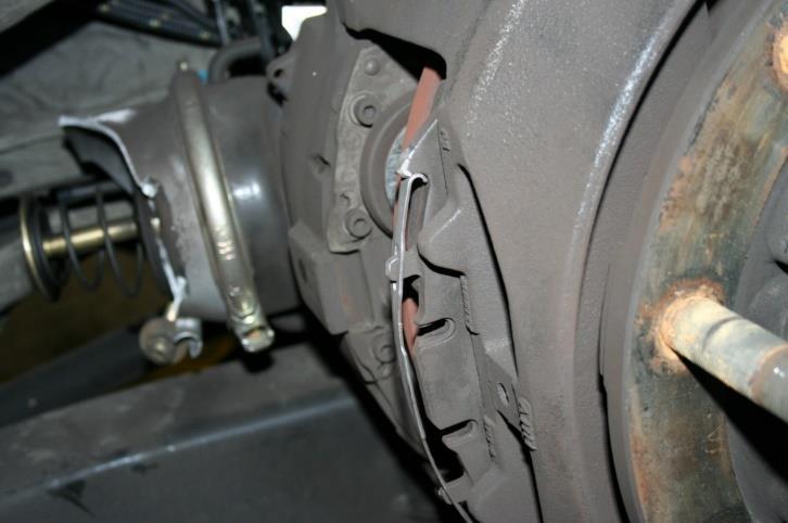 FIGURE 10 Other Types of Brake Assembly Damage Damage caused by a missing pad retainer strap Damaged rim and brake chamber caused by missing pad retainer strap 3.