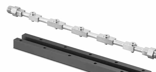 The complete MPC fluid system is assembled with simple mounting components and standard hardware. Substrate Layer The substrate layer provides the main flow path between the surface-mount components.