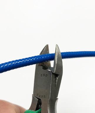 Procedure: 1. Cut the MX8031 Triaxial Cable to the desired length using an appropriate wire cutting tool.