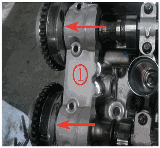 For 1st design shown, visually inspect for teflon camshaft thrust washers being present between the camshaft actuator and the saddle cap. 1st design (1) is for both intake and exhaust.
